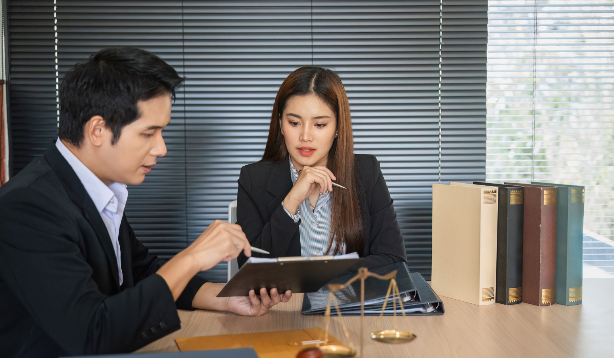 A lawyer prepares his client for immigration court